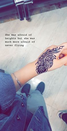 a woman's hand with a henna on it and a quote about love