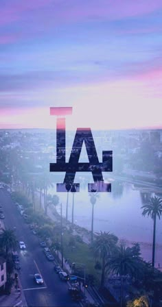 the los angeles dodgers logo is seen through a window at sunset in front of palm trees