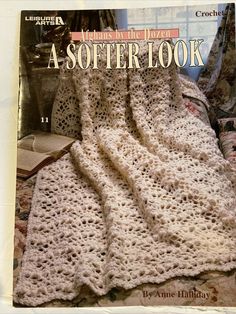 the cover of a crochet book with an image of a blanket on it