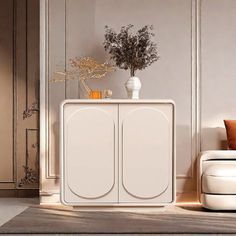 a white cabinet sitting in the middle of a living room