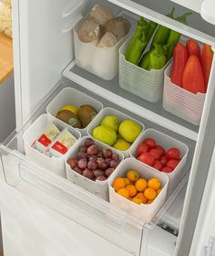 an open refrigerator filled with fruits and vegetables