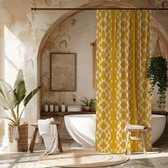 a bathroom with a yellow shower curtain next to a bathtub