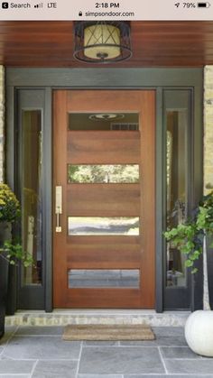 an image of a front door with plants and potted plants