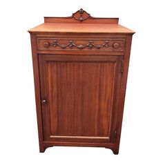 an old fashioned wooden cabinet with carvings on the top and bottom drawer, isolated against a white background