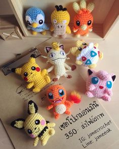 several crocheted pokemon keychains sitting on top of a table