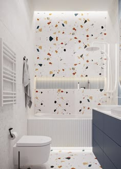 a bathroom with a toilet, sink and bathtub covered in confetti paper