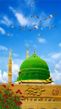 birds flying over the top of a building with a green dome and minage on it