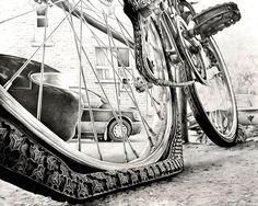 a pencil drawing of a bike tire and spokes