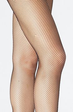 Black Fishnet Mesh Legwear, Black Fishnet Mesh Tights, Black Fishnet Bottoms, Stretch Fishnet Bottoms, Spring Black Mesh Legwear, Black Mesh Legwear For Spring, Black Tight Mesh Hosiery, Black Fishnet Mesh Hosiery, Black Stretch Fishnet Tights