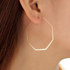 Gold Extra Skinny Hexagon Hoop Earrings, Extra Large Earrings. Minimalist Geometric Earrings, Gold Geometric Hoop Earrings  These Gold Extra Skinny Hexagon Hoop Earrings are in perfect size and lightweight. They are comfortable to wear, yet in a minimalist design to match your every outfit, giving a charm to the ensemble. This pair stands out humbly with its understated beauty. A perfect little gift. Add these beauties to your basket today!! -------DETAILS------- - The earrings are approximately 5.5cm top to bottom, including ear wire - The little gold Hexagon Hoops are approximately 5cm in diameter - The Hexagon Hoops are approximately 1mm thick - All metal is high quality - Free Beautifully wrapped & boxed -------PACKAGING------- We offer a free gift wrap option upon request. Just leave Style Moodboard, Fashion Diary, Geometric Hoop Earrings, Big Hoop Earrings, Handmade Jewel, Light Earrings, Long Dangle Earrings, Girl Jewelry, Earrings Minimalist