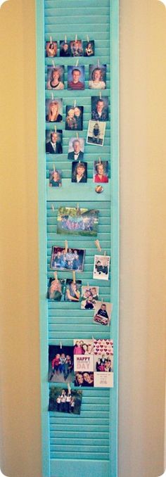 a blue shelf with pictures and photos on it