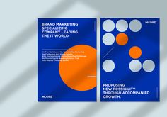 two brochures with orange and white circles on the front, one in blue