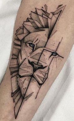 a black and white tattoo of a lion's head on the left arm with geometric lines