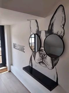 there is a dog mural painted on the wall next to a mirror and shelf in this room