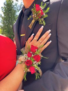 a close up of a person wearing a boutonniere