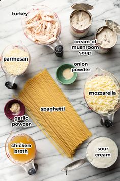 ingredients to make pasta laid out on a white marble counter top, labeled in italian words