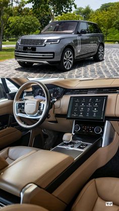 the interior and dashboard of a range rover parked in front of a driveway with trees