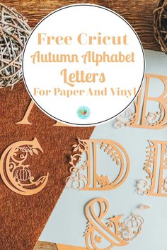 the free cricut autumn alphabet letters for paper and vinyl are displayed on a table