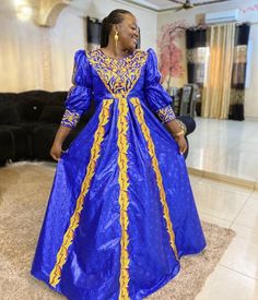 Description: This magnificent custom African dress is perfect for any occasion you want to look your best. It includes 3 pieces (Full dress, wrap-around or Skirt and head-tie).   Important Note: For broderie mix with bazin and garniture mix clothes only: Depending on the availability of the( fabric) / Garnitures (TRIMS) may be different than the one in the pictured. However, the dress will be sewn exactly in the style and colors shown. You can always request to see the fabrics or trims before we start by sending us a message along with your order. PROCESSING: We usually take 6- 8 BUSINESS DAYS to make the dress. SHIPPING: We use DHL shipping with tracking and text update. (3 to 5 days) SIZING: What we need from you We have a sizing Chart in the images. Scroll to the right. (Providing your Royal Long Sleeve Formal Dresses, Royal Style Fitted Fancy Dress, Royal Fitted Fancy Dress, Royal Fitted Dress For Formal Occasions, Elegant Gold Dress For Fancy Dress Occasions, Royal Floor-length Dress For Festive Occasions, Royal Floor-length Festive Dresses, Royal Blue Fitted Traditional Dress, Gold Long Sleeve Fancy Dress