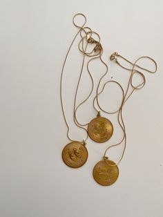 "Fabulous vintage brass zodiac pendant necklaces! One side has one of the 12 zodiac signs with a constellation on the other. Constellation is NOT of the zodiac. Large vintage pendant hangs on vintage 20\" gold plated serpentine chain. Perfect statement on its own or a complement to other layering chains! Pendant size: 1-1/4\" diam" Layering Chains, Libra And Sagittarius, Zodiac Pendant Necklace, 12 Zodiac Signs, 12 Zodiac, Zodiac Pendant, Zodiac Jewelry, Disc Necklace, Vintage Pendant