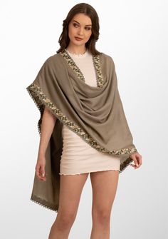 This classic natural scarf is woven from a luxurios wool and silk blend. It features a striking multi-color embroidery appliquŽ border that is further enveloped with a fine natural lace detailing. The embroidery adds a touch of sophistication whilst the exquisite lace detailing makes this scarf a must-have accessory for the fashion-forward individual. Wrap yourself in style and make a bold fashion statement with this versatile scarf that seamlessly blends warmth with artistic flair. Elegant Shawl With Embroidered Border, Elegant Beige Shawl With Resham Embroidery, Elegant Pashmina Shawl With Embroidered Border, Elegant Shawl With Embroidered Border In Traditional Drape, Elegant Multicolor Embroidered Dupatta, Elegant Resham Embroidery Shawl Scarf, Elegant Shawl With Floral Embroidery In Traditional Drape, Elegant Shawl With Floral Embroidery, Elegant Shawl With Floral Embroidery, Traditional Drape