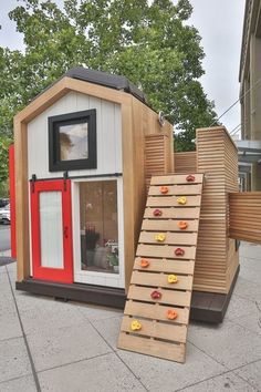 an outhouse with stairs leading up to it