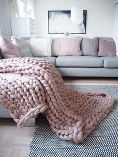 a large blanket is draped over a couch