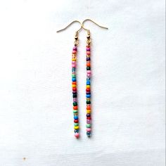 Colorful Boho Handmade Glass Seed Beaded Dangle Stick Earrings Finished With Gold Tone Hook Ear Wires Gypsy Hippie Retro Mod Nickel Free Gold Tone Hook Ear Wires With Clear Backs To Help Keep In Place Dainty Tiny Glass Seed Beads In Multi Colors, Randomly Chosen By Me To Create You A Beautiful Unique Pair Of Earrings Using The Same Bead Colors Yet Randomly Selected Approximately 3.25 Inch Length Handmade Beautiful Earrings To Wear Daily Or Give As A Gift For Christmas, Anniversary, Birthday, Val Glass Seed Bead Earrings, Minimalist Beaded Earrings, Adjustable Beaded Earrings With Dangling Beads For Everyday, Adjustable Beaded Chain Earrings For Summer, Trendy Dangle Beaded Earrings For Festivals, Trendy Beaded Dangle Earrings For Festival, Trendy Festival Dangle Beaded Earrings, Handmade Multicolor Heishi Beads Earrings, Adjustable Beaded Earrings With Heart And Round Beads