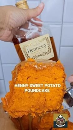 a person holding a bottle of henny sweet potato pound cake