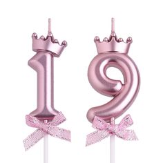 a pink cake topper with a number one on it