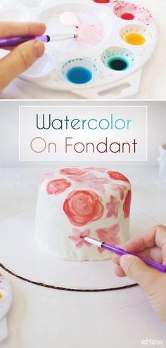 someone is painting a cake with watercolors on fondant and then it's ready to be frosted