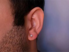 Discover the elegance of our 0.08ct Diamond Men's Solitaire Earring, crafted in 14K Gold. This unique stud earring features a tiny, brilliant gemstone, perfect for those who appreciate minimalist and refined jewelry. Its sleek design makes it an ideal accessory for everyday wear, adding a subtle touch of sophistication to any outfit. ⚜️ Package included: Handmade Earring - Made to order ⚜️ Materials: 14k Yellow Gold / 14k White Gold / 14k Rose Gold ⚜️ 1. Gemstone: Genuine Diamond ▪ Carat: 0.08 ▪ Unique Studs, Earring Minimalist, Minimalist Men, Stud Earrings Unique, Solitaire Earrings, Men Earrings, Dainty Earrings, Minimalist Earrings, Stud Earring