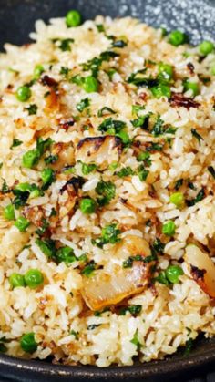 rice with peas and onions in a skillet