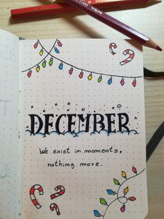 a notebook with the words december written on it