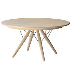 a round wooden table with metal legs