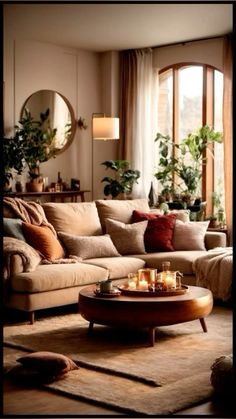 a living room filled with lots of furniture and candles on top of a coffee table