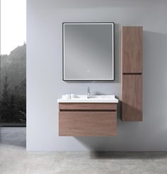 a bathroom vanity with a mirror above it and a sink under the cabinet next to it