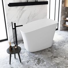 a white bath tub sitting on top of a bathroom floor next to a black shelf