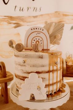 a white and brown cake sitting on top of a table