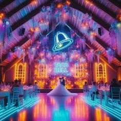 a bride and groom standing in front of an illuminated dance floor