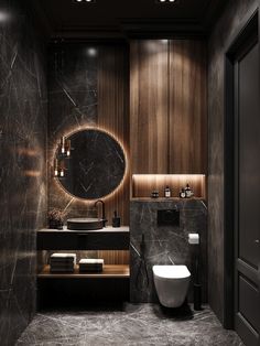 a modern bathroom with marble walls and flooring, including a round mirror above the sink