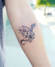 a woman's arm with a tattoo on it that has an image of a horse