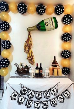 a birthday party with champagne and balloons