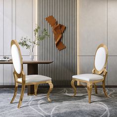 two white chairs sitting next to each other in front of a wooden table and wall