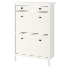 a white dresser with two drawers on it