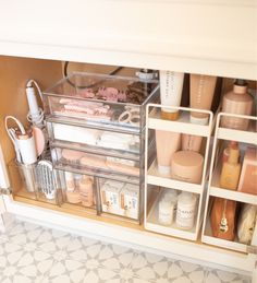 an organized bathroom cabinet filled with cosmetics and personal care items