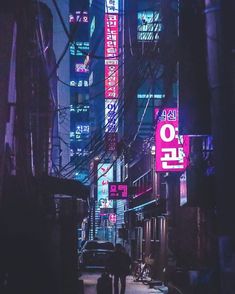 an alley way with neon signs and people walking down it