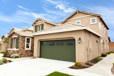 a house with two garages in front of it