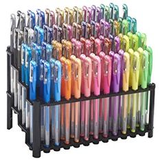 a rack with many different colored pens in it