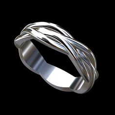 a silver ring on a black background